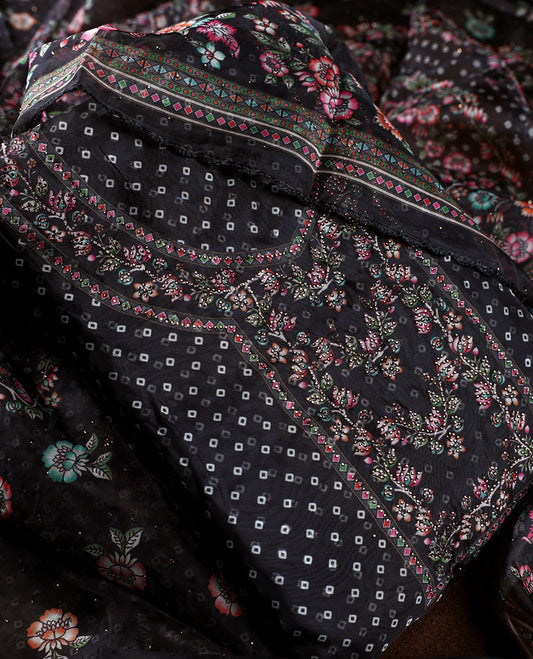Chic black churidhar material adorned with delicate floral, stone and vine motifs, paired with a vibrant printed dupatta and plain matching bottom, offering a perfect blend of elegance and festive charm.