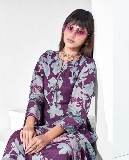 Purple colour pure muslin suit set featuring purple grey colour digital floral printed top featuring sequin butti embroidery and a scalloped floral embroidered border, paired with a dyed pure viscose muslin bottom and a digital printed dupatta.