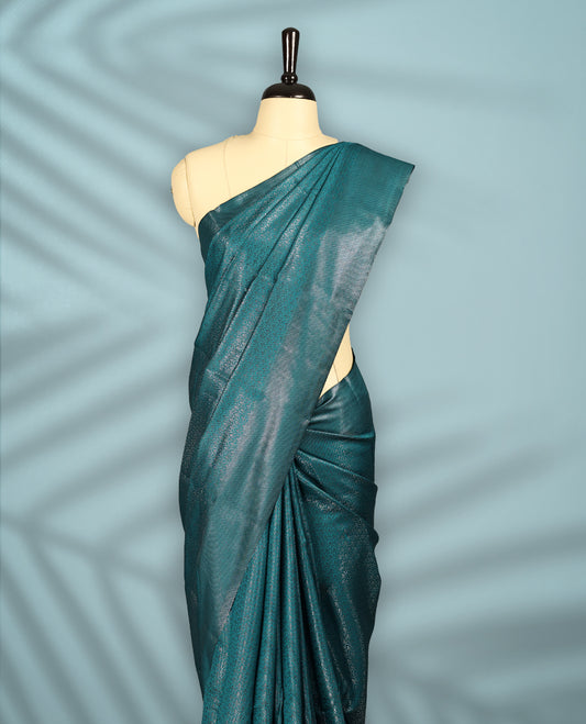 Deep Aqua Colour semi silk saree featuring an intricate Zari  motif weave across the body, paired with a zari worked border with matching blouse.