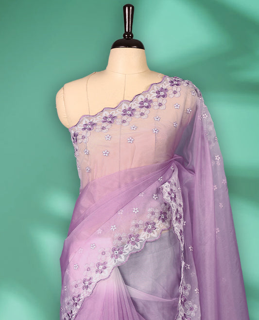 Lavender and White colour double shade organza saree with delicate floral embroidery on body, intricately embroidered scallop border, floral embroidered design on pallu, with matching blouse
