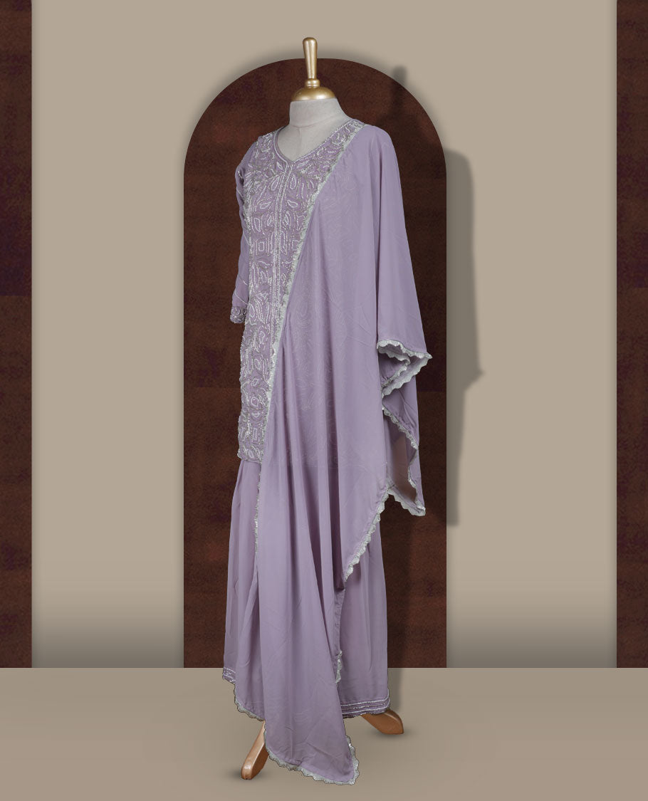 Elegant Lavender colour sharara set featuring an intricately embroidered top with cut beads work and three quarter sleeves, paired with a flowy flared bottom and a matching dupatta adorned with delicate borders.