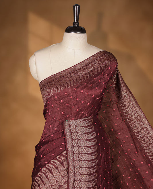 Deep Brown colour Banarasi Bandhani silk saree featuring with intricate orange colour circle motifs on body, complemented by antique zari woven border and grand pallu, paired with matching  blouse