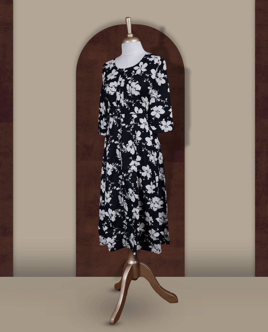 Black colour kurthi featuring with beigecolour floral prints all over & Designed with a round neckline, button placket, and 3/4 sleeves.
