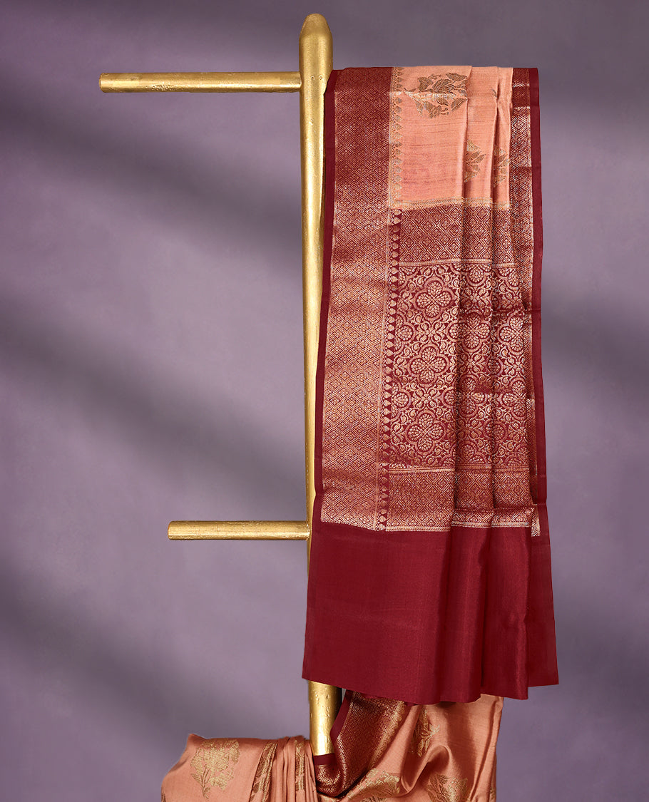 Peach Colour Pure Banaras Soft Silk Saree adorned with traditional antique zari motifs, paired with a hand dyed Maroon antique style border and a matching blouse.