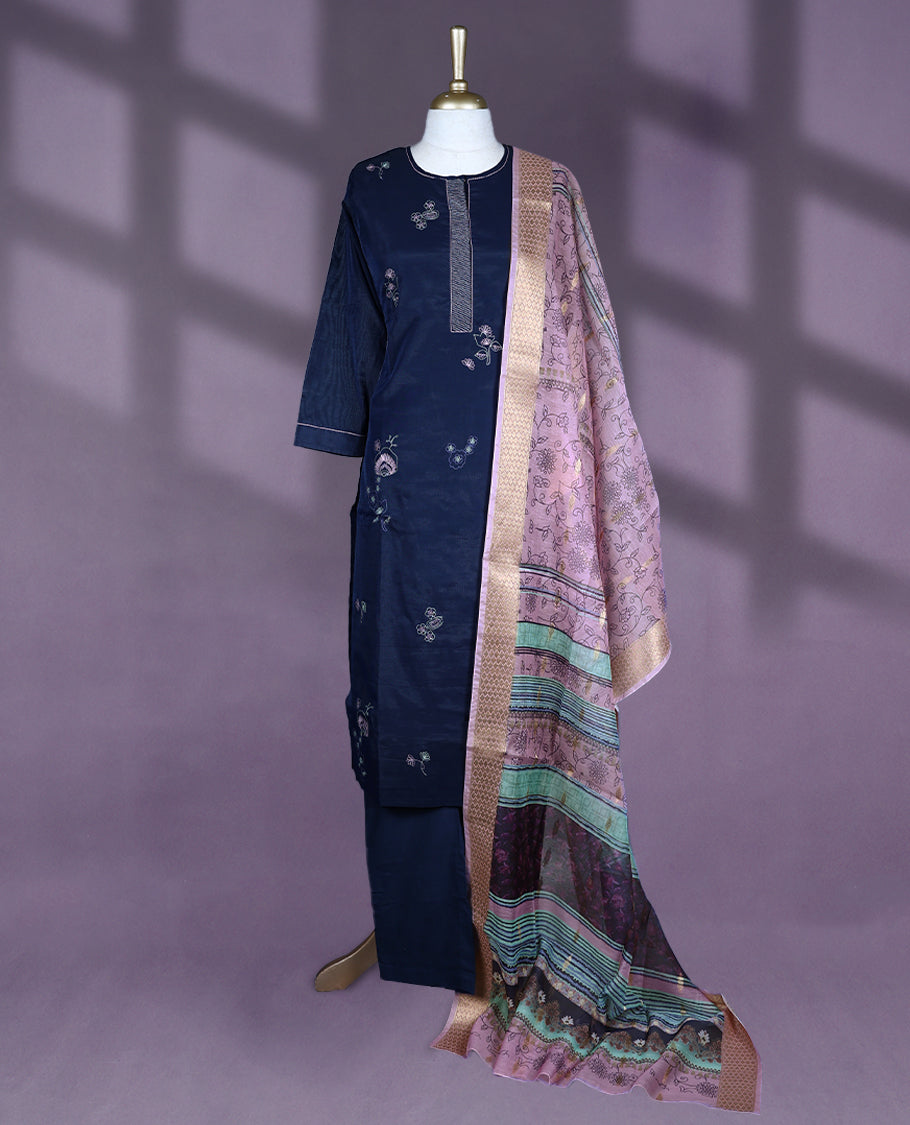 Navy blue Colour kurti set featuring a straight-cut silhouette with 3/4th sleeves, a simple round neckline with a front placket, and delicate floral embroidery, paired with plain Bottam & a richly patterned pastel dupatta with golden detailing.