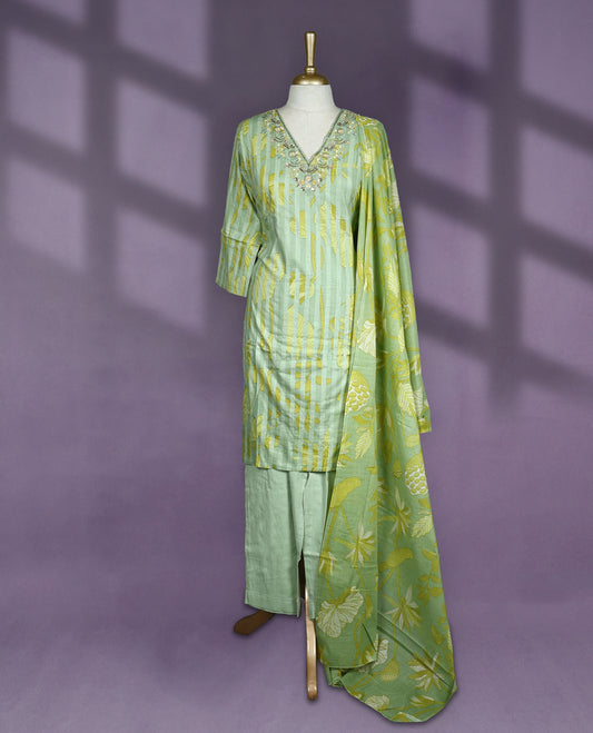 Pastel green colour salwar set with V neck and elbow sleeves featuring floral embroidery on neckline and yellow leaf prints on body paired with matching plain bottom and green floral printed dupatta