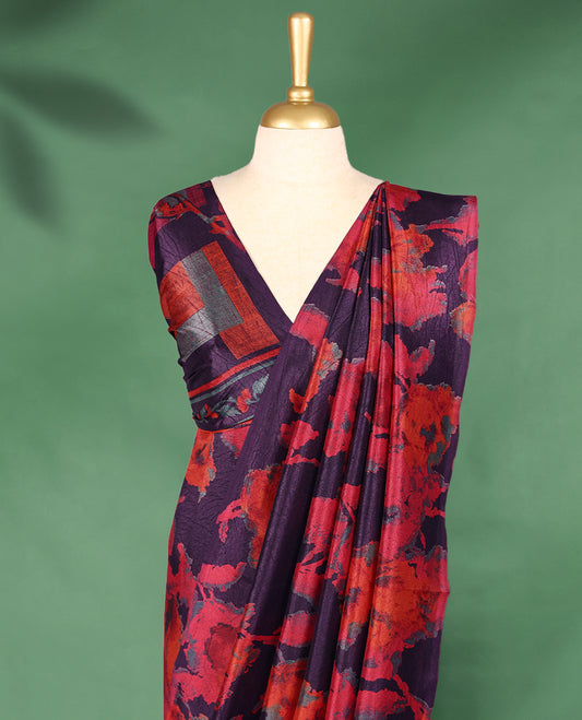 Dark plum colour Manipuri saree featuring oversized crimson and burnt orange floral motifs, finished without a border, and paired with a matching blouse.