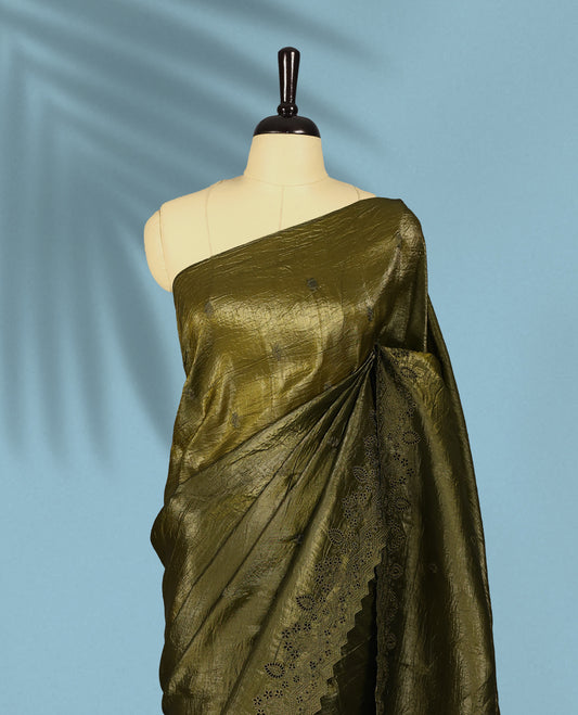 Olive Colour crush soft silk saree, textured body with a natural crinkled finish, adorned with intricate self colored floral Motifs and complemented by a delicate thread embroidery cutwork border, paired with a matching blouse