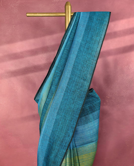 Teal and blue colour pure linen saree featuring broad horizontal stripes in shades of green and sky blue, complemented by a sleek self border and comes with a matching blouse