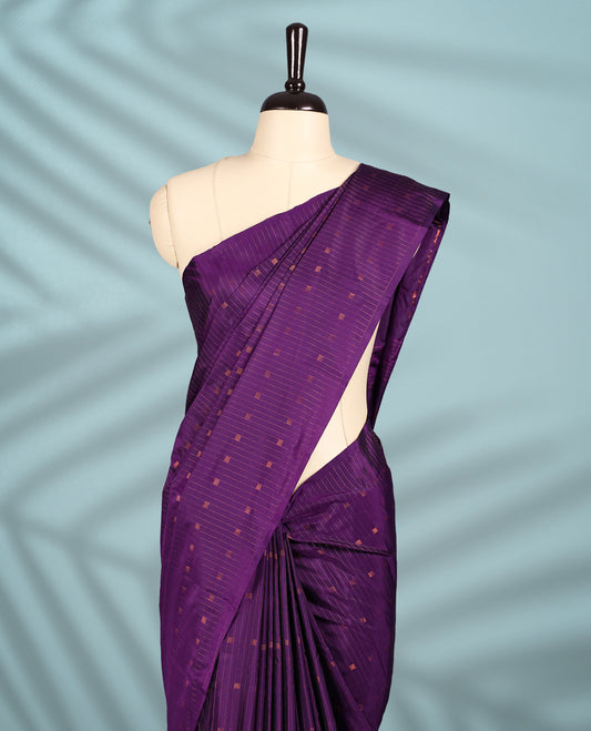Deep violet colour semi silk saree with fine copper zari stripes and dotted motifs across the body, without have a border, Comes with a matching blouse.
