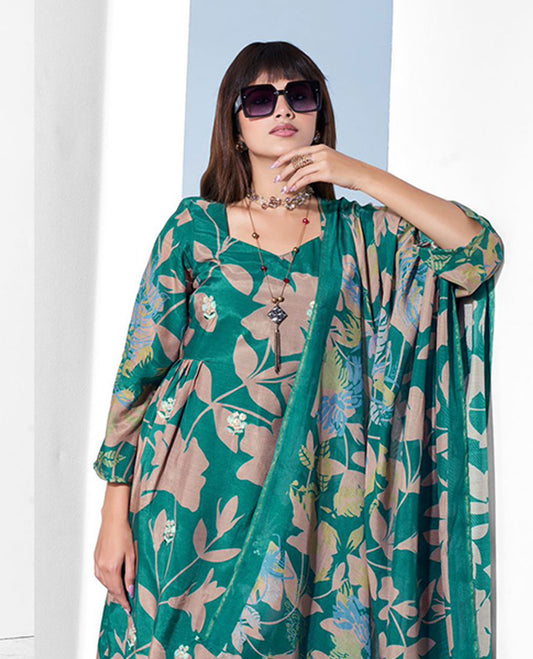 Deep teal colour suit set with a pure muslin digital printed top featuring sequin butti embroidery and a scalloped floral embroidered border, paired with a dyed pure viscose muslin bottom and a digital printed dupatta.