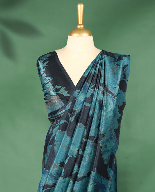Midnight blue colour Manipuri saree featuring oversized teal floral motifs, finished without a border, and paired with a matching blouse.