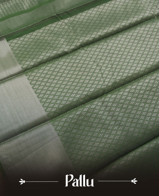 Dark green colour semi silk saree featuring neem zari Brocade Pattern all over the body, complemented by a Self Colour woven border with detailing, Pallu & blouse.