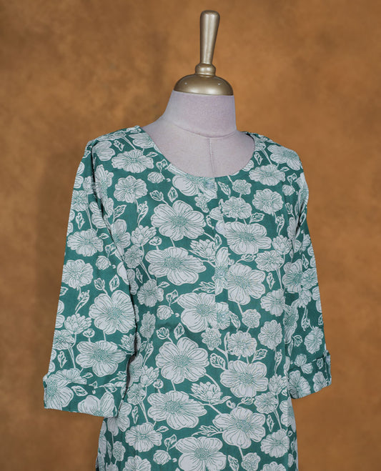Dark green and white colour kurti with White floral prints, knee length design, styled with a round neckline and a sleeve .
