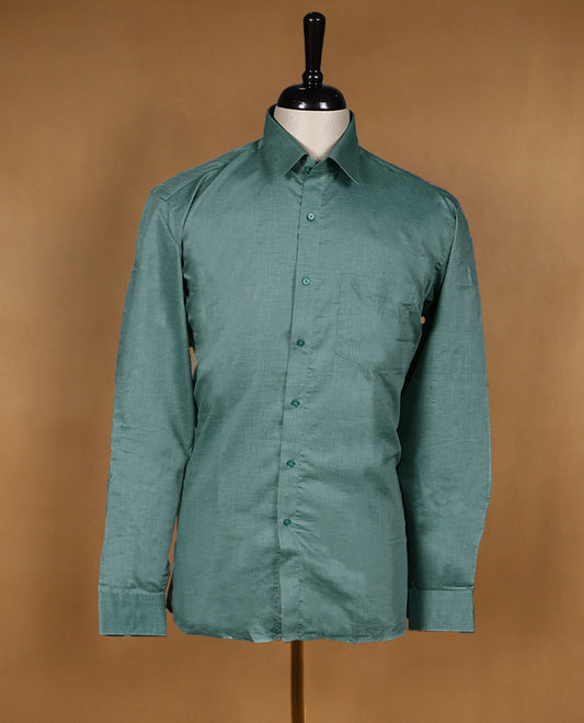 Dusty teal green colour OTTO men’s shirt in a relaxed formal fit featuring a subtle self textured body, classic collar, full sleeves, and front chest pocket ideal for office or smart casual wear.