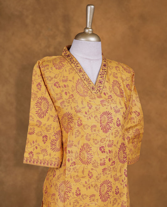 Mustard colour kurti with Maroon floral prints, knee length design, styled with  thread pattern around neckline and a sleeve .