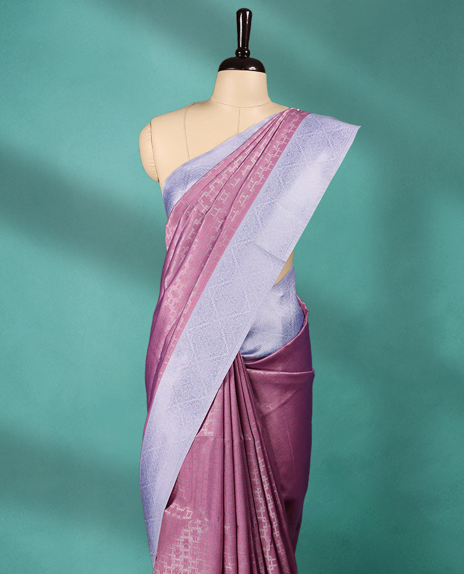 Pink coloured semi silk saree featuring a Zari design on the body, paired with a Baby Blue coloured border and matching blouse.
