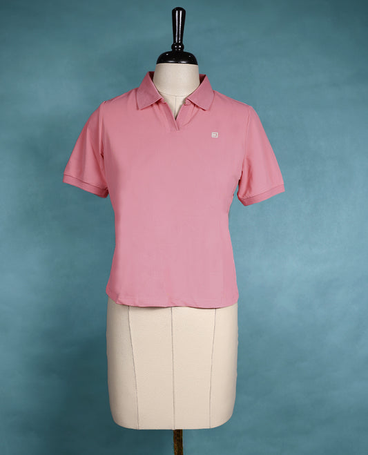 Soft pink polo neck top with short sleeves and a waist length cut, perfect for everyday wear.