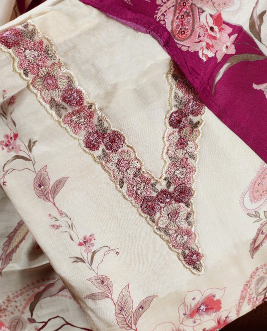 Cream colour churidhar material with pink floral and paisley prints, enhanced by a dark magenta border and delicate embroidery & Comes with matching plain bottom and dupatta.