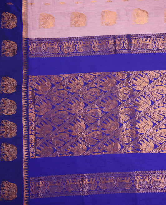 Dual shade Lavender and Royal Blue Kalyani cotton saree featuring intricate zari woven elephant motifs across the body, complemented with a rich zari border and pallu, paired with a matching blouse.