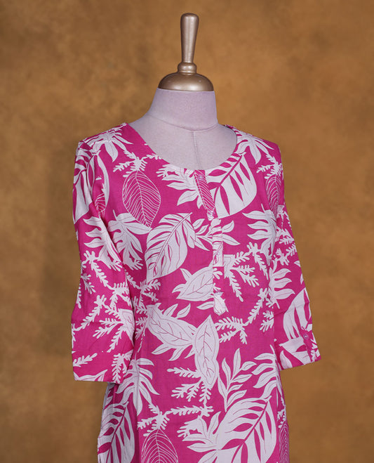 Pink colour kurti with White floral prints, knee length design, styled with a round neckline and a sleeve .