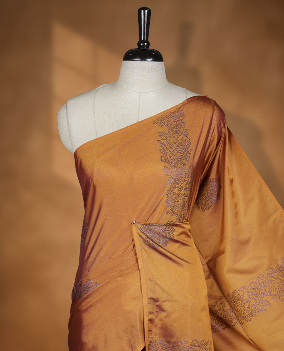 Mustard colour semi soft silk saree adorned with delicate woven floral kodi motifs on the body, complemented by a Self colour woven pallu with intricate detailing and tassel accents without border & Comes with a matching blouse piece.