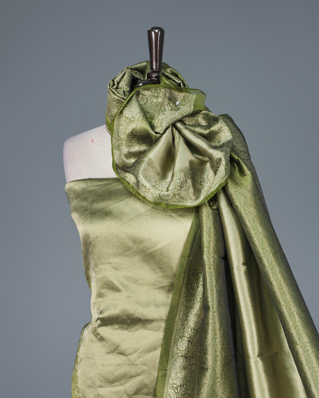 Green colour Tissue Salwar Material featuring subtle lotus floral motifs On Body ,paired with a matching bottom & graceful shaded Dupatta.