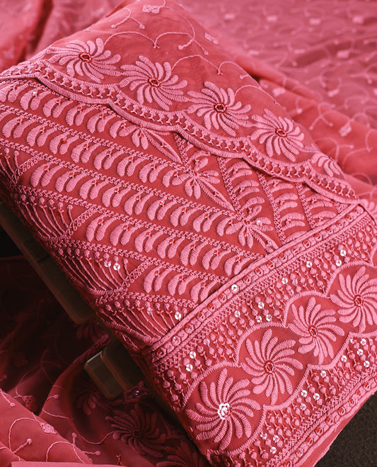 Rose wine colour churidhar material adorned with intricate floral embroidery and sequin highlights, paired with a plain matching bottom and beautifully embroidered dupatta, perfect for festive celebrations and graceful occasions.