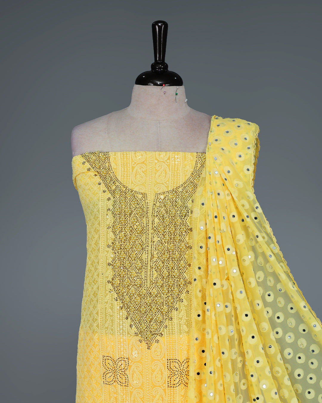 Yellow Colour Georgette Salwar Material featuring elegant Chikankari work on the kurta, paired with a matching bottom and a sequins-embellished dupatta.