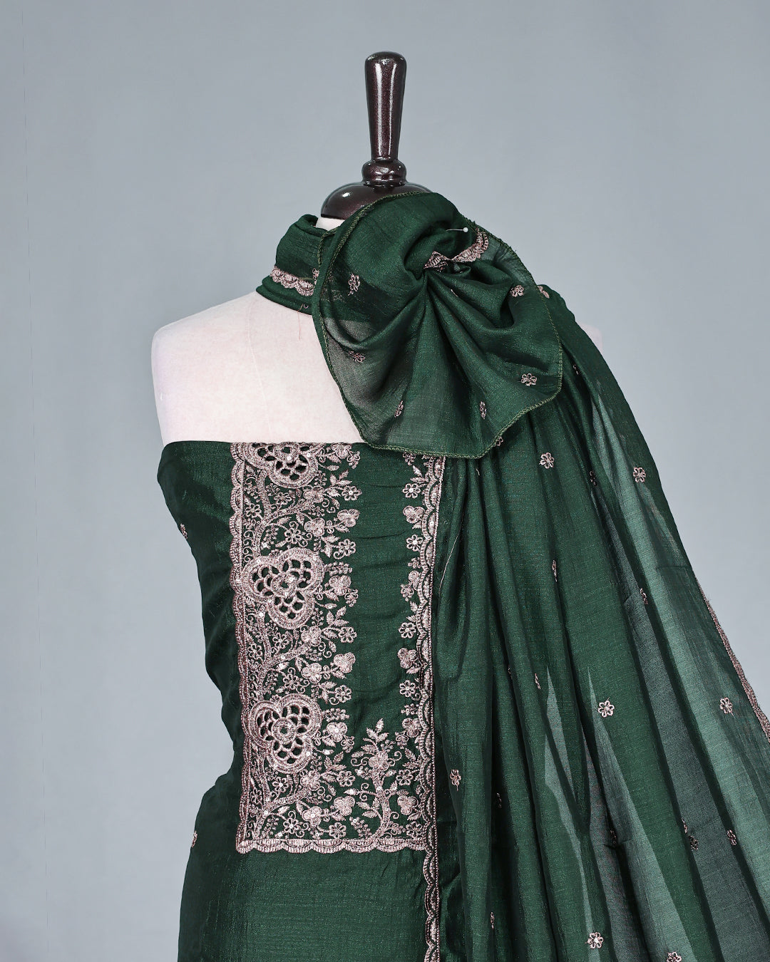Bottle Green colour  Vijitra Silk Salwar Material featuring elegant white thread embroidery on the front panel, paired with a matching bottom and a gracefully embroidered dupatta.