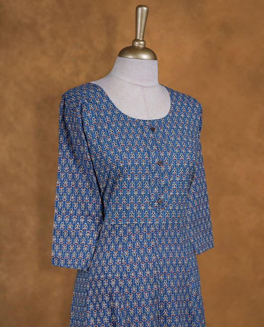 Blue colour kurti covered in tiny off‑white and red floral motifs, styled with a scoop neckline, buttoned front yoke and comfy 3/4th sleeves.