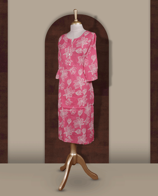 Soft pink colour kurthi adorned with delicate beige colour floral prints, featuring a stylish V notch round neckline and comfy 3/4th sleeves.