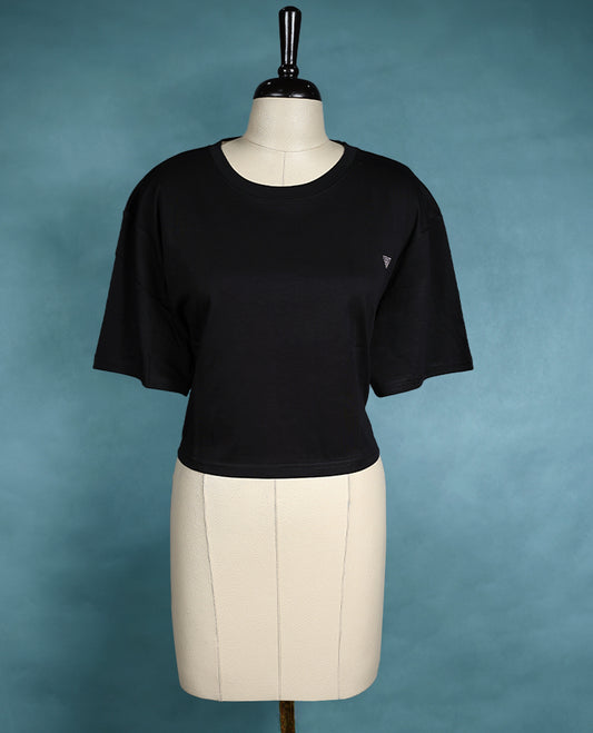 Black oversized T shirt featuring a round neck and dropped shoulders, crafted from soft cotton for a relaxed and modern silhouette.