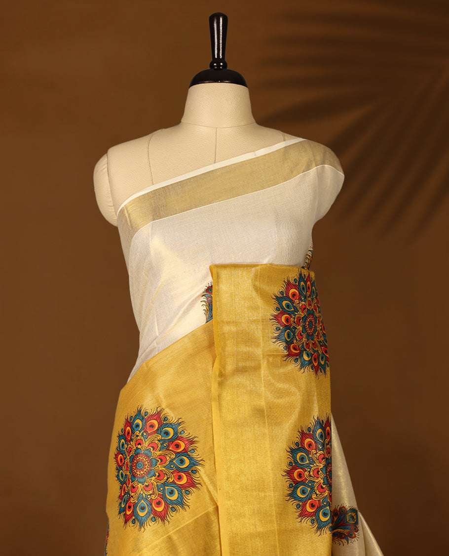 Mustard & Light Gold colour Tissue Kerala saree featuring Bold Floral Printed body and traditional golden zari kasavu border offering a classic and graceful look, paired with a matching blouse.