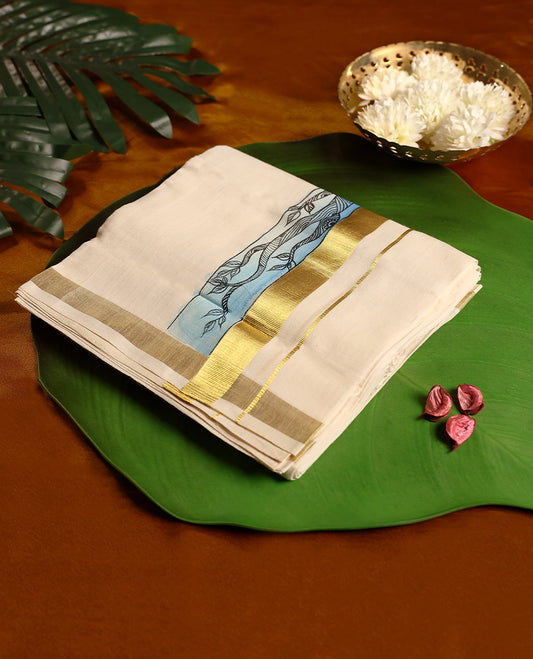 Off white pure handloom double dhoti featuring a golden zari kara and an artistic blue Krishna motif design, blending traditional craftsmanship with cultural elegance, perfect for rituals and festive occasions