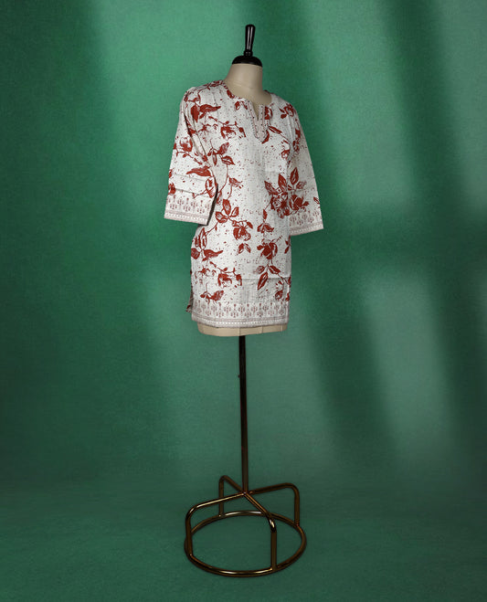 Beige colour short kurti with brown floral prints and intricate border detailing on the hem and sleeves, featuring a V slit round neckline and 3/4th sleeves, perfect for everyday comfort and style.