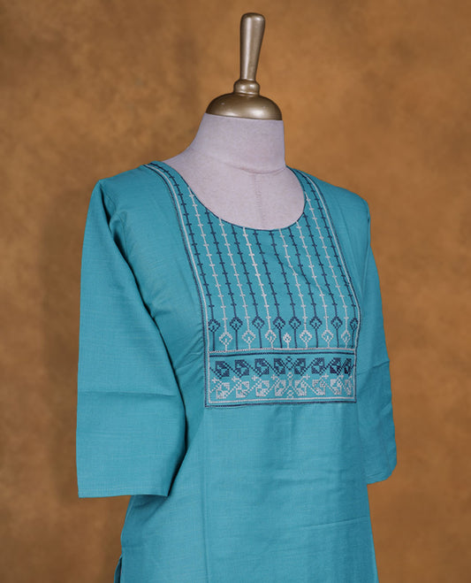 Aqua blue colour kurti with styled with a white & blue thread pattern around neckline, knee length design, and a sleeve .