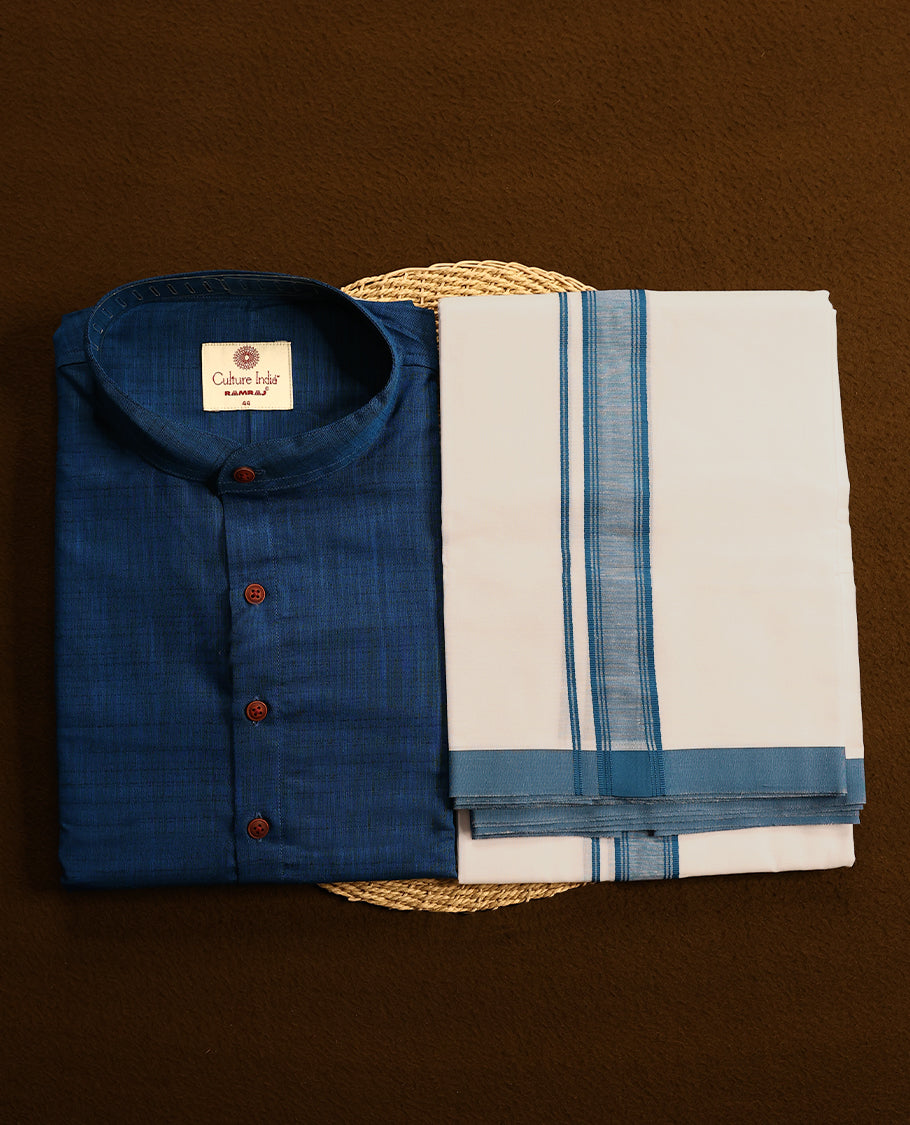 RAMRAJ Blue kurtha paired with a white dhoti, elegantly finished with a matching Blue border.