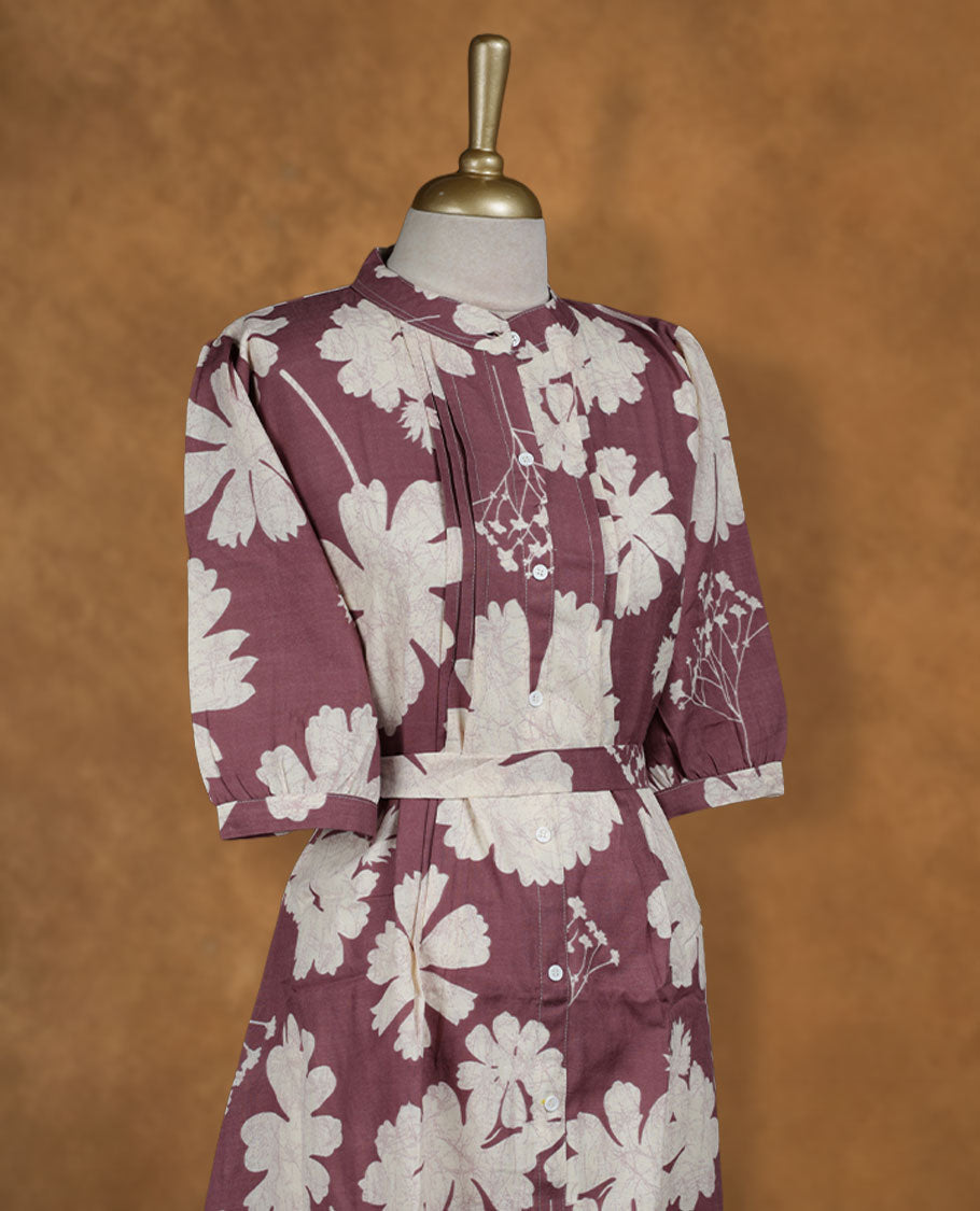 Wine maroon floral printed knee-length shirt dress with band collar, pintuck-detailed yoke, matching waist belt, and half sleeves.