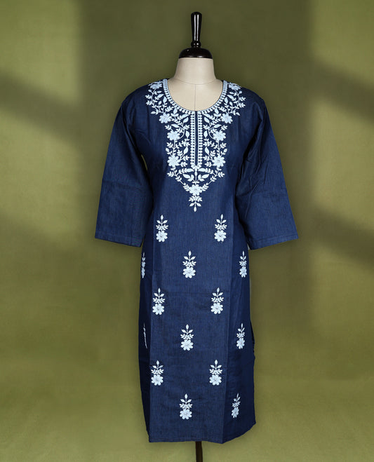 Deep navy blue colour kurti featuring intricate white floral thread embroidery on the yoke and all over the front panel, designed with a rounded neckline and keyhole detail, paired with 3/4th sleeves and straight hemline