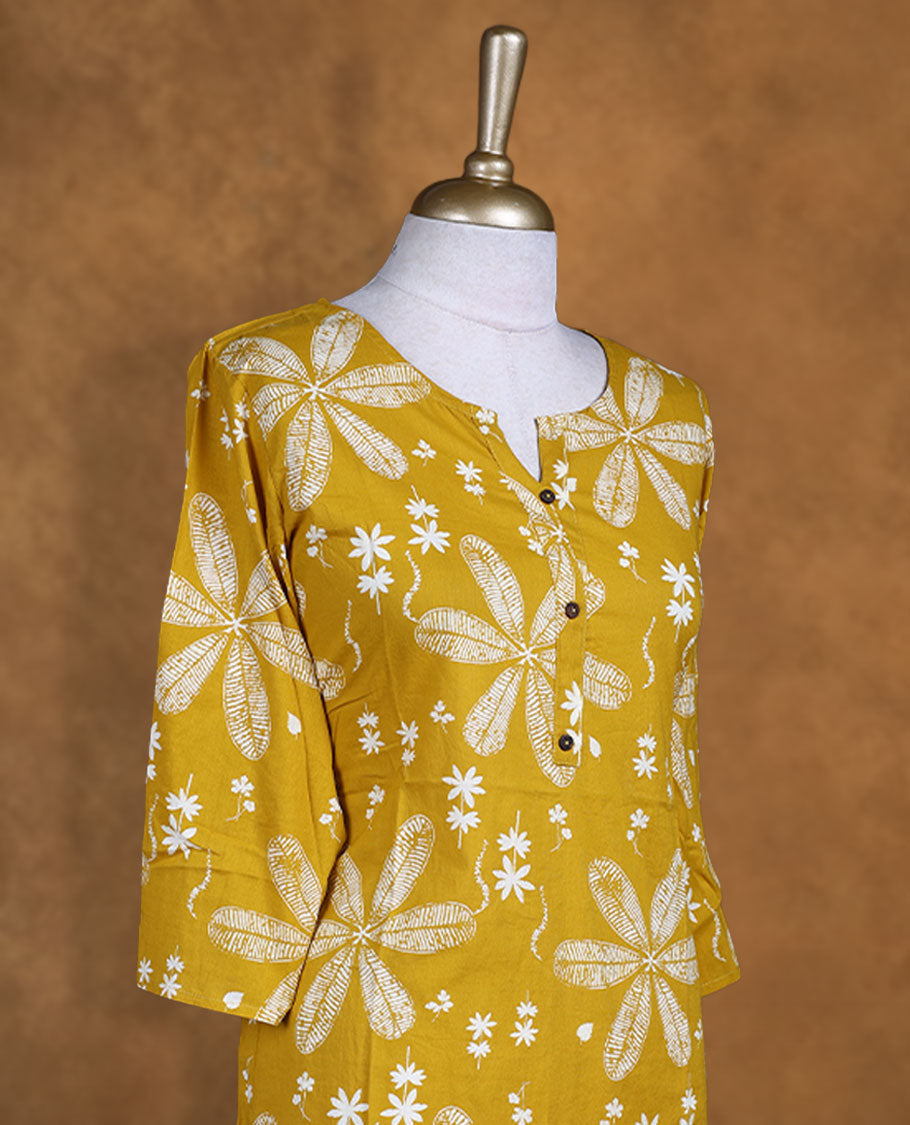 Mustard and white colour kurti with White floral prints, knee length design, styled with a round neckline and a sleeve .