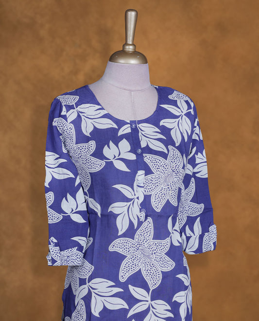 Imperial blue and white colour kurti with White floral prints, knee length design, styled with a round neckline and a sleeve .