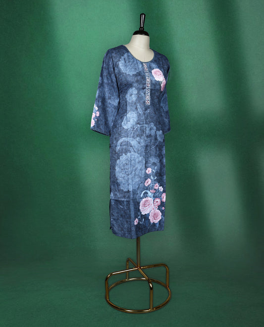 Denim blue straight cut kurti crafted in soft cotton, featuring elegant floral prints in pastel pink, a round neckline with embroidered button placket, and 3/4th sleeves with printed detailing perfect for casual and semi formal wear
