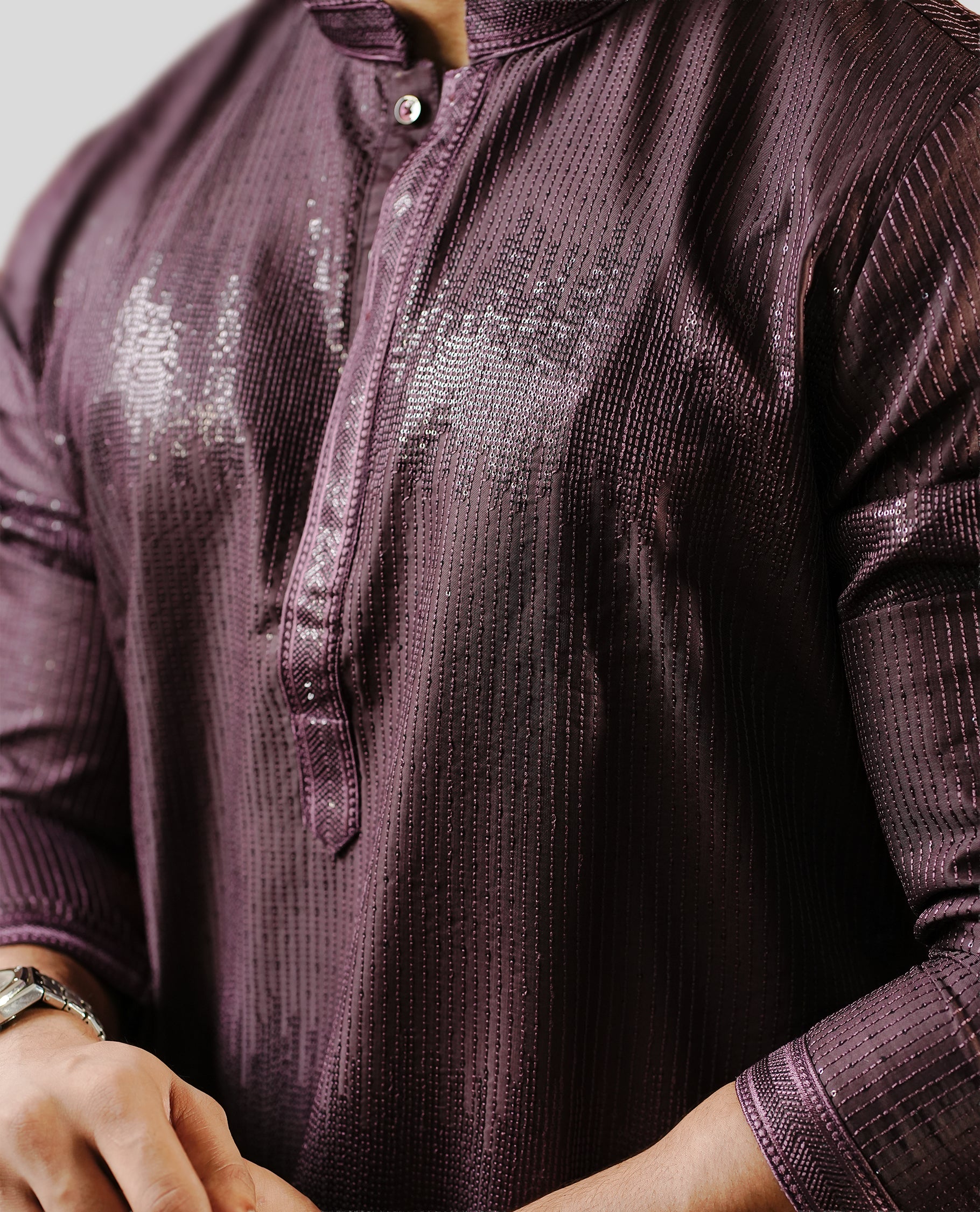BlackBerry colour men's kurta featuring elegant thread and sequins work on the body, complemented by full sleeves for a refined and festive look.