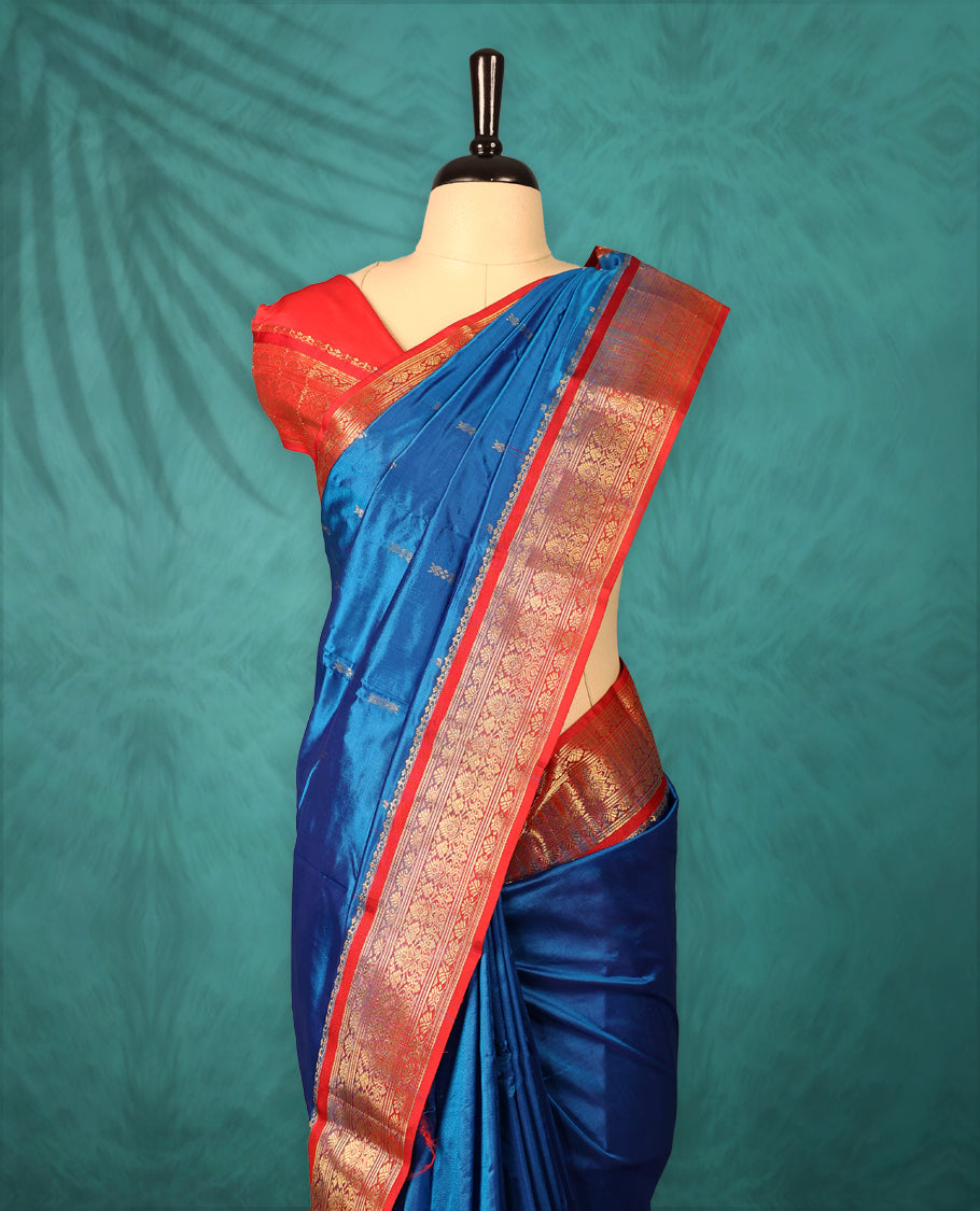 Blue colour Dharmavaram saree with small gold motifs on body, Rich Red traditional border with intricate gold zari weaving, grand zari pallu, perfect for Bharatanatyam, with matching blouse.