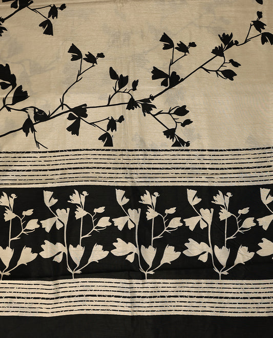 Beige colour semi printed saree featuring black florak kodi prints across the body, finished with a Golden Zari border, with matching blouse