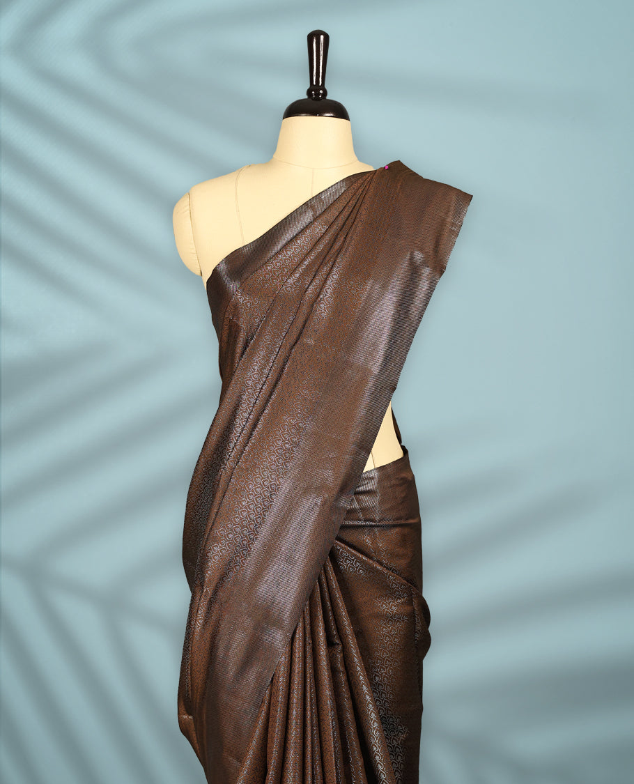 Deep Brown Colour semi silk saree featuring an intricate Zari  motif weave across the body, paired with a zari worked border with matching blouse.