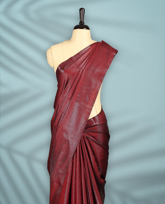 Deep Red Colour semi silk saree featuring an intricate Zari  motif weave across the body, paired with a zari worked border with matching blouse.