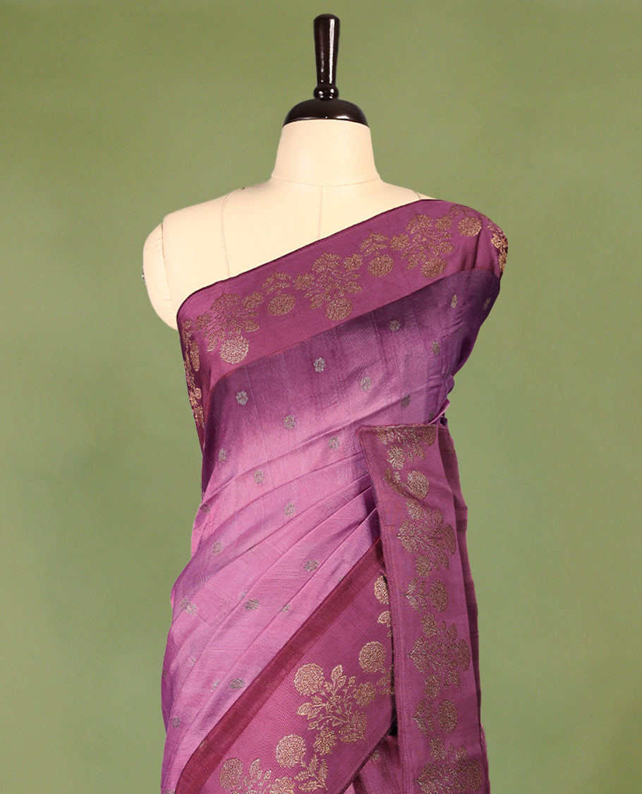 Onion pink and grape wine double shade semi Banaras Tussar Georgette saree adorned with elegant antique gold zari floral motifs across the body, featuring a detailed woven border and grand pallu, paired with a matching blouse piece.