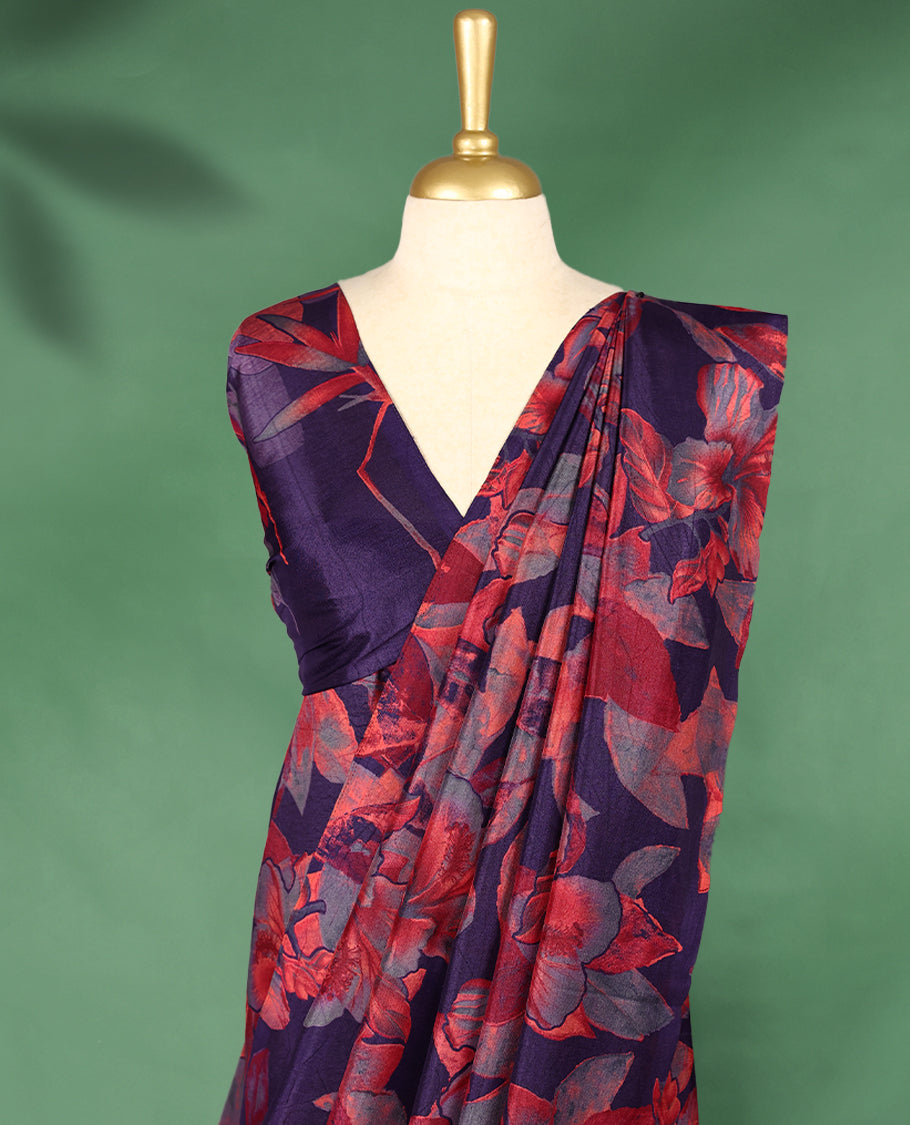 Deep purple colour Manipuri saree features a body with bold red and grey floral prints, a minimal border, and comes with a matching blouse.